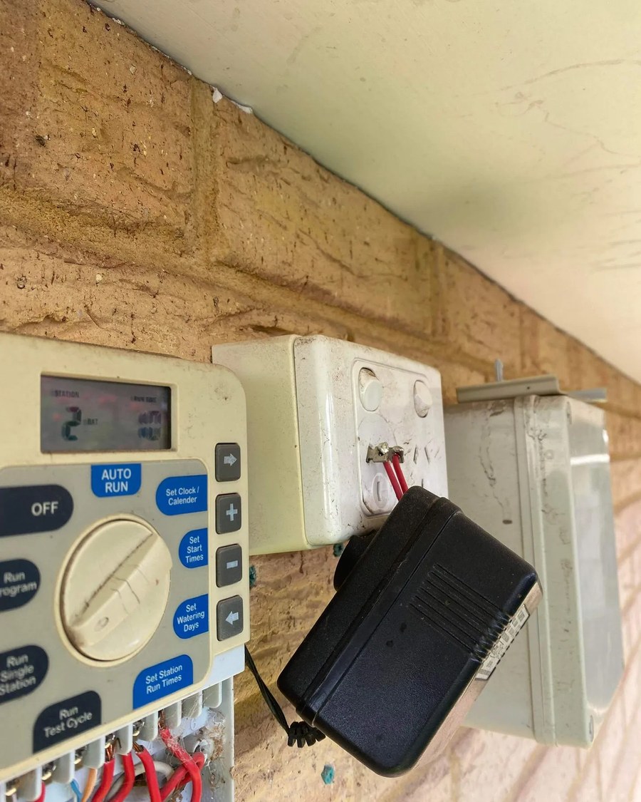 Specialist technician diagnosing irrigation system